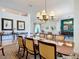 Open-concept dining room with a large dining table and views of the living spaces at 28410 Wildlife Ln, Brooksville, FL 34602
