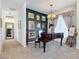 Elegant dining area featuring a baby grand piano and tasteful wall decor at 28410 Wildlife Ln, Brooksville, FL 34602