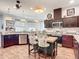 Modern kitchen with stainless steel appliances and a breakfast bar at 28410 Wildlife Ln, Brooksville, FL 34602