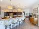 Open kitchen with breakfast bar seating and dark cabinetry, perfect for entertaining at 28410 Wildlife Ln, Brooksville, FL 34602