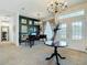 Inviting living room with stylish decor, a grand piano, and a chandelier at 28410 Wildlife Ln, Brooksville, FL 34602