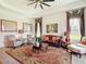 Inviting living room showcasing elegant decor, comfortable seating, and a detailed area rug, creating a cozy ambiance at 28410 Wildlife Ln, Brooksville, FL 34602