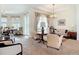 Cozy living room with comfortable seating, elegant decor, and natural light streaming through the windows at 28410 Wildlife Ln, Brooksville, FL 34602