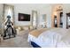 Bright main bedroom with a comfortable seating area, doors, and lots of light at 28410 Wildlife Ln, Brooksville, FL 34602