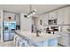 Modern kitchen features a large island, stainless steel appliances, and stylish pendant lighting at 3329 Fresno Pl, Zephyrhills, FL 33541
