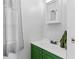 Bathroom featuring white walls, a large mirror, and a green vanity with silver hardware at 3333 26Th E Ave # 1090, Bradenton, FL 34208
