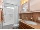 Charming bathroom with granite counters, a shower-tub combo, and wood-look accent paneling at 3333 26Th E Ave # 1090, Bradenton, FL 34208