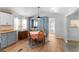 Cozy dining room with built-in cabinets and adjacent sunroom access at 3333 26Th E Ave # 1090, Bradenton, FL 34208