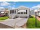 Charming single-Gathering home with a well-manicured lawn, complemented by a spacious driveway and inviting entrance steps at 3333 26Th E Ave # 1090, Bradenton, FL 34208