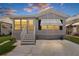 Charming single-Gathering home featuring a well-manicured lawn and spacious driveway at dusk with great curb appeal at 3333 26Th E Ave # 1090, Bradenton, FL 34208