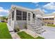 Charming single-Gathering home with a well-manicured lawn, complemented by inviting entrance steps and a screened porch at 3333 26Th E Ave # 1090, Bradenton, FL 34208