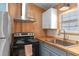 Updated kitchen with stainless steel range hood and stainless sink at 3333 26Th E Ave # 1090, Bradenton, FL 34208
