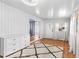 Bright living room featuring hardwood floors, white walls, and a cozy rug, with doorway to kitchen, and ample natural light at 3333 26Th E Ave # 1090, Bradenton, FL 34208