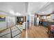 Spacious open-concept living area seamlessly connecting the kitchen and living spaces, with hardwood floors and ample natural light at 3333 26Th E Ave # 1090, Bradenton, FL 34208
