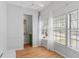 Well-lit sun room showcasing beautiful wood-look floors and large windows that fill the room with sunlight at 3333 26Th E Ave # 1090, Bradenton, FL 34208
