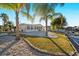 Backyard with palm trees, a boat dock, and a glimpse of the house's exterior at 4059 Orient Dr, Hernando Beach, FL 34607