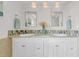 Bathroom featuring double sinks, decorative tile backsplash, and hanging pendant lights at 4059 Orient Dr, Hernando Beach, FL 34607