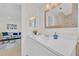 Bathroom with a white vanity, modern fixtures, and a view into the living room at 4059 Orient Dr, Hernando Beach, FL 34607