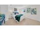 Cozy bedroom featuring a queen-size bed, blue and green accents, and tiled floor at 4059 Orient Dr, Hernando Beach, FL 34607