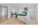 Bright bedroom with a queen-size bed, stylish decor, and view to entry hall at 4059 Orient Dr, Hernando Beach, FL 34607