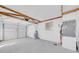 Spacious garage with exposed beams, ample storage, and an automatic door opener at 4059 Orient Dr, Hernando Beach, FL 34607