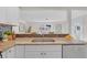 Kitchen with granite countertops, mosaic backsplash, and stainless steel dishwasher at 4059 Orient Dr, Hernando Beach, FL 34607