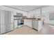 Modern kitchen featuring stainless steel appliances, white cabinetry, and granite countertops at 4059 Orient Dr, Hernando Beach, FL 34607