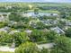 An aerial showcasing the property near a lake and golf course, with lush green landscaping at 4209 Winding Willow Dr, Tampa, FL 33618