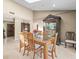 Bright dining room featuring a glass top table, decorative cabinet, and neutral tones with a light, airy feel at 4209 Winding Willow Dr, Tampa, FL 33618