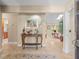 Open foyer with tile flooring and view into the living room with skylights at 4209 Winding Willow Dr, Tampa, FL 33618