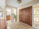 Double front doors with decorative glass accents and tile flooring in the foyer at 4209 Winding Willow Dr, Tampa, FL 33618