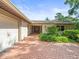 Home features brick paved walkway leading to double front doors and attached garage at 4209 Winding Willow Dr, Tampa, FL 33618