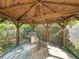 Backyard covered gazebo with grill, offers a cozy outdoor cooking and dining space at 4209 Winding Willow Dr, Tampa, FL 33618