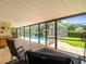 Relaxing screened patio with pool access, perfect for outdoor living and entertaining at 4209 Winding Willow Dr, Tampa, FL 33618
