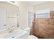 Tiled bathroom features tiled shower and vanity with granite countertop, combining functionality and style at 4414 Royal Oak Ln, New Port Richey, FL 34653