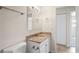Updated bathroom features a granite countertop vanity, ceramic tile, and updated fixtures at 4414 Royal Oak Ln, New Port Richey, FL 34653
