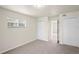 A carpeted bedroom with closet and bright window offer a clean, calming space at 4414 Royal Oak Ln, New Port Richey, FL 34653