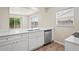 Well-lit kitchen features stone counters, stainless appliances, and ample storage for an enjoyable cooking experience at 4414 Royal Oak Ln, New Port Richey, FL 34653