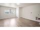 The expansive laundry room boasts wood floors and utility hookups for modern appliances at 4414 Royal Oak Ln, New Port Richey, FL 34653