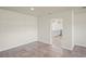 Spacious room with tile flooring and a view of the kitchen, perfect for entertaining at 4414 Royal Oak Ln, New Port Richey, FL 34653