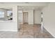 Bright and open-concept living space with tile floors seamlessly connecting to a modern kitchen at 4414 Royal Oak Ln, New Port Richey, FL 34653