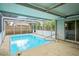 Inviting screened-in pool area with ample space for relaxation and entertainment at 4414 Royal Oak Ln, New Port Richey, FL 34653