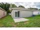 Charming backyard with a patio, perfect for relaxing or entertaining guests outdoors at 456 Summer Sails Dr, Valrico, FL 33594