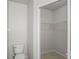 Walk-in bathroom closet features tile flooring and white shelving at 456 Summer Sails Dr, Valrico, FL 33594