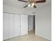 Bedroom with ceiling fan and ensuite bathroom with access to large closet at 456 Summer Sails Dr, Valrico, FL 33594
