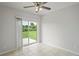 Bedroom with sliding glass doors leading to a patio and backyard view at 456 Summer Sails Dr, Valrico, FL 33594