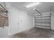 Garage interior showing door to house, garage door and some utilities at 456 Summer Sails Dr, Valrico, FL 33594