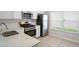 Well-equipped kitchen features stainless steel appliances, white cabinetry, and a double sink at 456 Summer Sails Dr, Valrico, FL 33594