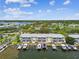 Aerial view of waterfront community with private docks and water views under blue sky at 4984 Beach Se Dr # B, St Petersburg, FL 33705