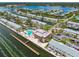 Aerial view of community clubhouse with swimming pool, tennis courts, and bay views at 4984 Beach Se Dr # B, St Petersburg, FL 33705